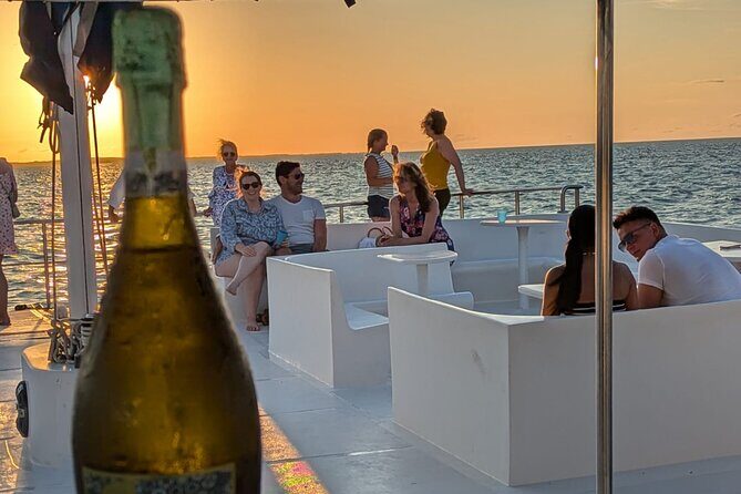Sunset Cruise from Providenciales - The deck vibe: music, dancing, and drink-and-photo momentum
